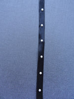 Black ribbon with pearls