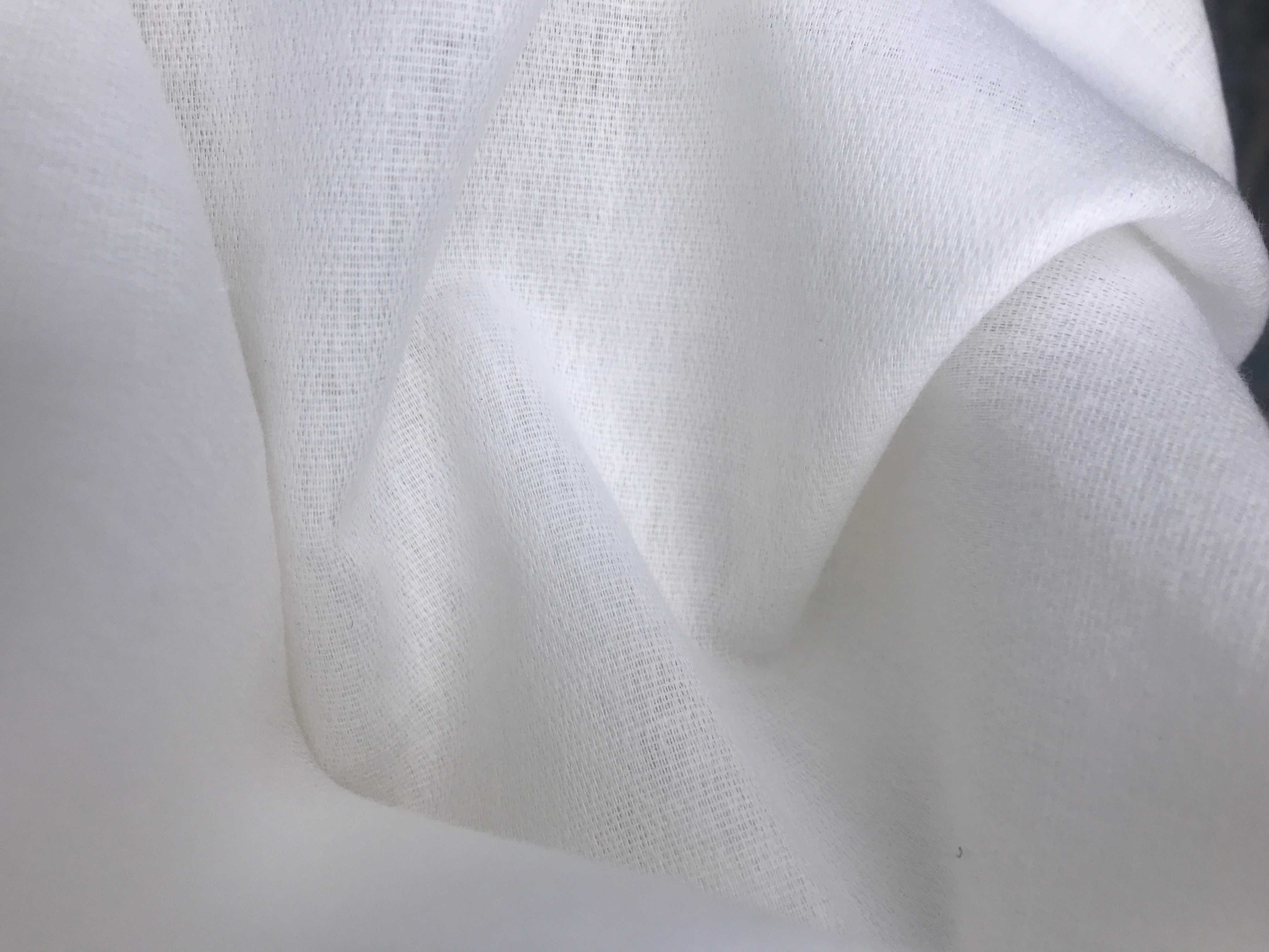 Cotton Wool Mix Interlining with polyamide adhesive for soft handfeel. 105g and 150cm wide